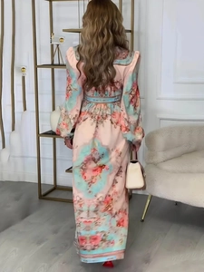 Detail of elegant floral print maxi dress featuring back zipper and cinched waist design
