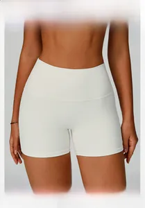 Macro shot of off-white ribbed high-waist yoga shorts highlighting the premium fabric texture