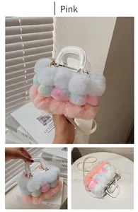 Detail view of rainbow plush handbag with white PU handles and detachable metal strap