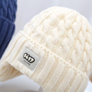 Kids chunky knit beanie with ear flaps and patch detail in cream white color