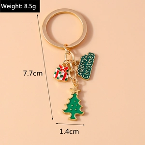 Detail of Christmas tree keychain with Merry Christmas tag and gift box charm