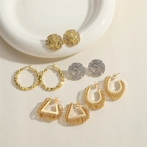 Baroque vintage lion head studs and geometric gold hoop earrings set with rhinestones