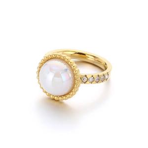 Golden pearl ring with diamond accents and semi-circle beads on a minimalist band