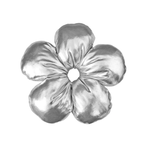 Close-up of metallic silver fabric hair scrunchie in five-petal flower shape with texture