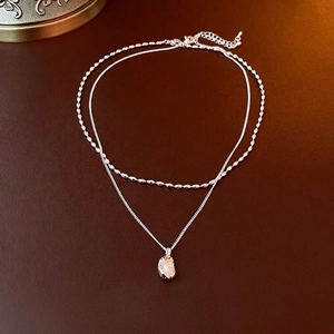 French double-layer necklace with silver chains, pearl pendant on brown leather