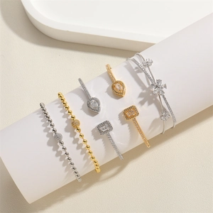 Elegant set of zircon-studded bracelets featuring teardrop, square, and floral designs