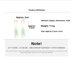 Detail view of long shell drop earrings with dimensions and material specifications