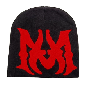 Detail of black knitted beanie featuring red jacquard letter pattern and fine texture