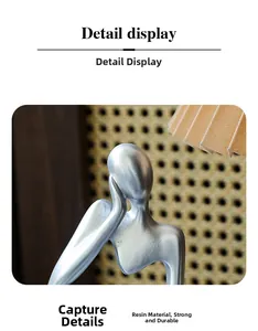 Detail display of silver thinker sculpture made of durable resin for modern home decor
