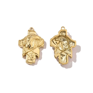 Detailed macro view of golden shield pendants with eagle head relief and polished finish