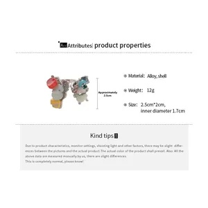 Detail view of flower shell ring showing dimensions 2.5cm by 2cm and alloy material specs