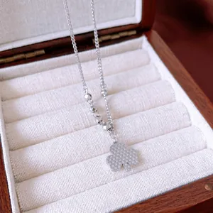 Vintage silver clover pendant necklace with textured finish and beaded chain in a gift box