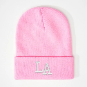 Close-up of pink rib-knit beanie featuring gray 3D embroidered LA letters logo