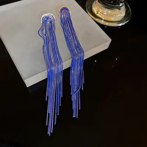 Long chain tassel earrings with gold semicircular studs and navy blue metal fringes