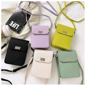 Detailed arrangement of mini crossbody bags in black, lavender, yellow, cream, and green