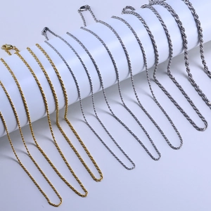 Macro shot of gold and silver S925 sterling silver rope chains with lobster clasps