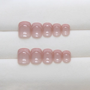 Classic nude pink French press-on nails with light pink tips in a short square shape