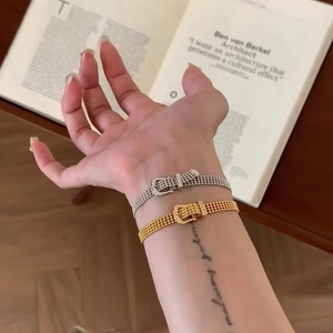 14K gold plated horseshoe buckle mesh bracelet with sparkling cubic zirconia on model