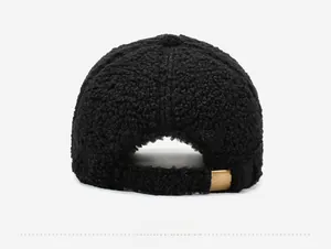 Detail view of the black sherpa fleece baseball cap back with golden metal buckle adjustor
