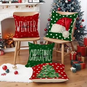 Set of four Christmas linen pillow covers with festive hats and trees on a wooden chair