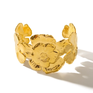 Adjustable 18K gold-plated stainless steel cuff bracelet featuring embossed flower patterns