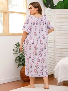 Close-up of plus size lavender floral nightgown with lace trim and short sleeves