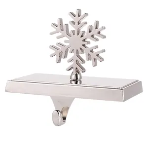 Close-up of polished silver snowflake Christmas stocking holder with heavy duty metal hook