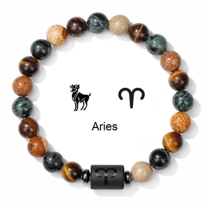 Detailed macro of Aries zodiac beaded bracelet with natural tiger eye stones on white background