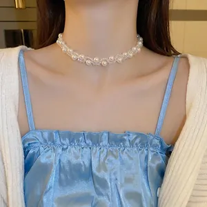 French vintage pearl and crystal beaded choker necklace worn by a model on a silk top