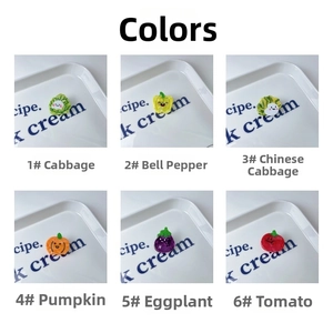 Detailed view of colorful resin fruit and vegetable hair clips with cute facial expressions