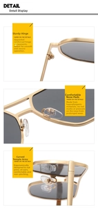 Detail view of reinforced hinges and nose pads on golden aviator driving sunglasses