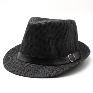 Close-up of black woven straw fedora hat with leather band and silver buckle detail