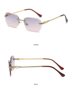 Detail view of purple gradient rimless sunglasses with gold metal legs and crystals