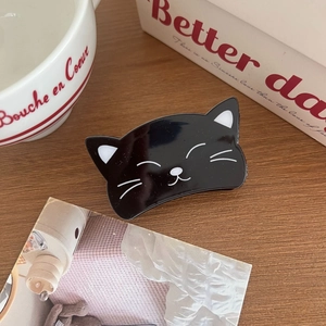 Pince à cheveux chat noir en acrylique brillant pour queue de cheval sur bois