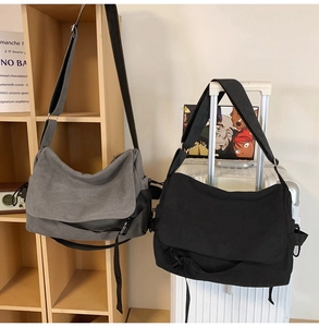 Detailed comparison of gray and black canvas messenger bags with durable buckle closures