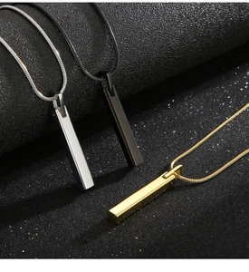 Detailed trio of polished vertical bar pendants in silver, gold, and black on a snake chain