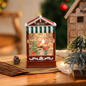 Close-up of a lit Christmas coffee house lantern with swirling snow and Santa