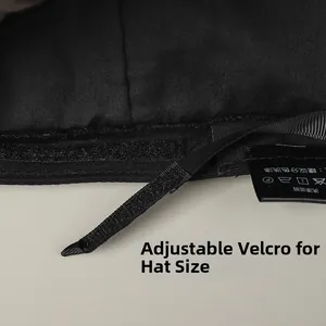 Adjustable Velcro strap and care label detail inside the black linen newsboy hat
