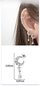 Detail view of crescent moon stud earrings with zircon heart and teardrop pendant