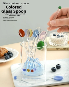 Detailed view of colorful heat-resistant glass stirring spoons for coffee and desserts