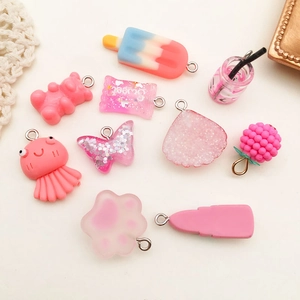 Variety of pink resin charms including gummy bears and sweets for DIY keychains