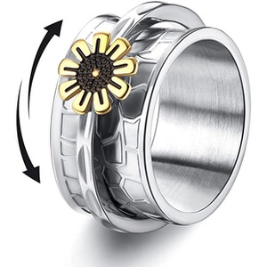 Detailed view of spinner ring with rotating golden sunflower on honeycomb texture band