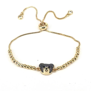 Bracciale regolabile dorato con ciondolo orso in zirconi neri e perle d'oro rotonde