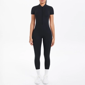 Close-up of black short sleeve yoga bodysuit with stand collar and front zipper detail