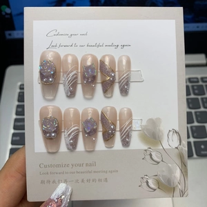 Exquisite handmade 3D press-on nails with rose, pearl, and butterfly in soft nude pink