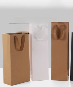 Vertical kraft paper wine bags in brown and white with matching fabric handles