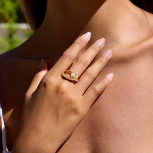 Detail of double-layered gold ring with marquise and round-cut cubic zirconia stones