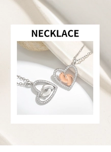 Macro detail of heart-shaped footprint pendant necklace with crystal pave in rose gold