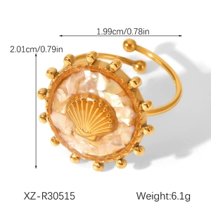 Golden adjustable shell ring with iridescent inlay and beaded edge design detail