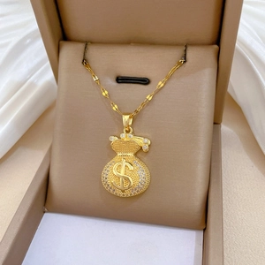 Macro shot of 18K gold plated money bag necklace with crystal pavé and dollar sign detail
